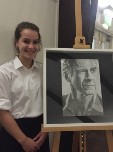 Phoebe Hessien with her pencil drawing of Sir Ranulph which was sold during the silent auction